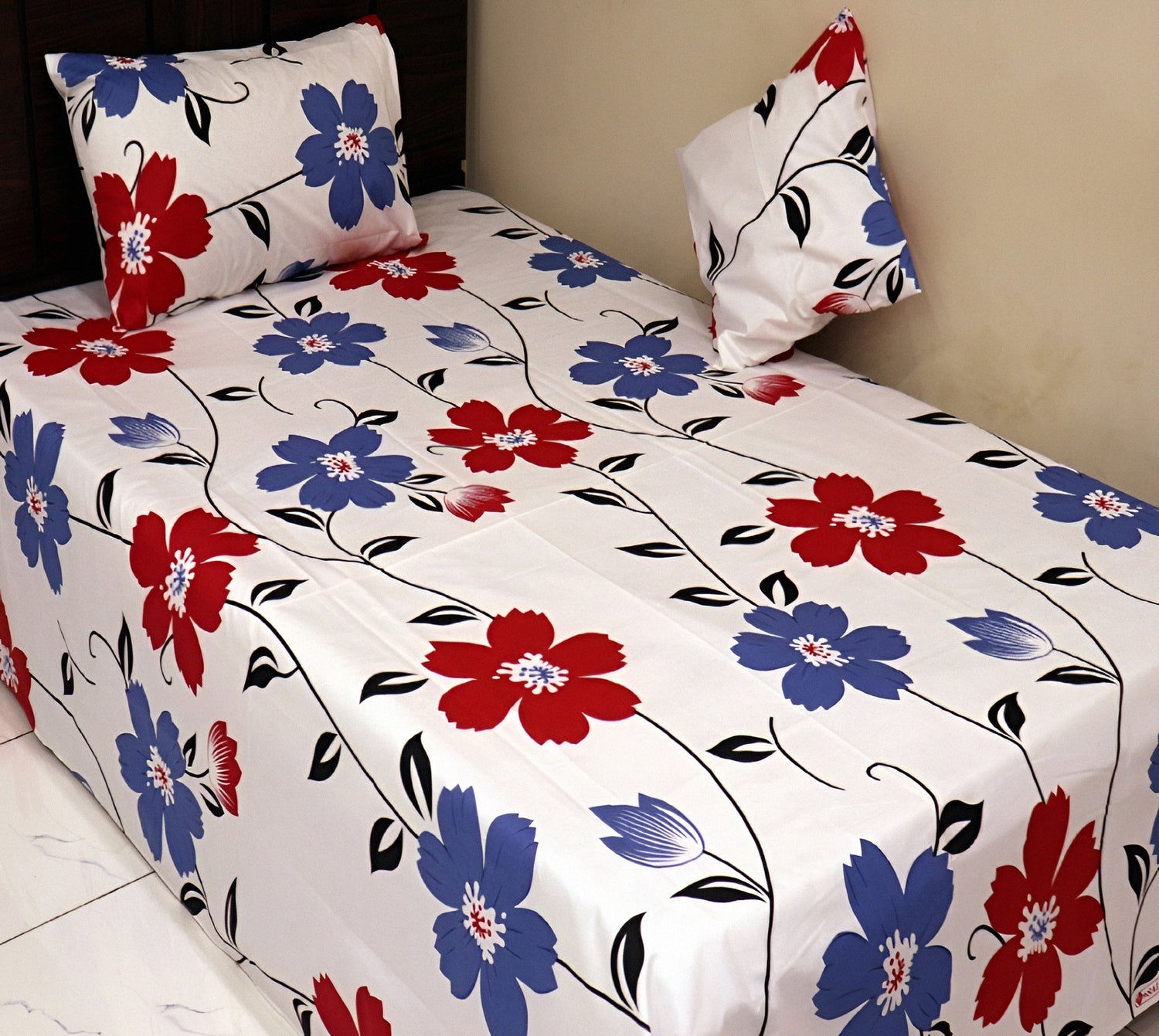 Off-white cotton bedsheet with red and blue floral design