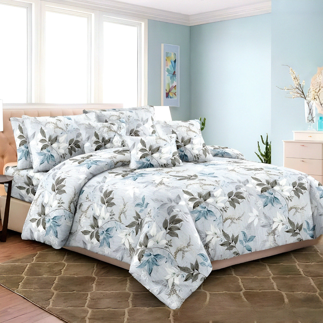 Blue floral bedsheet on a styled bed — طقم ملاية زهرية زرقاء على سرير أنيق