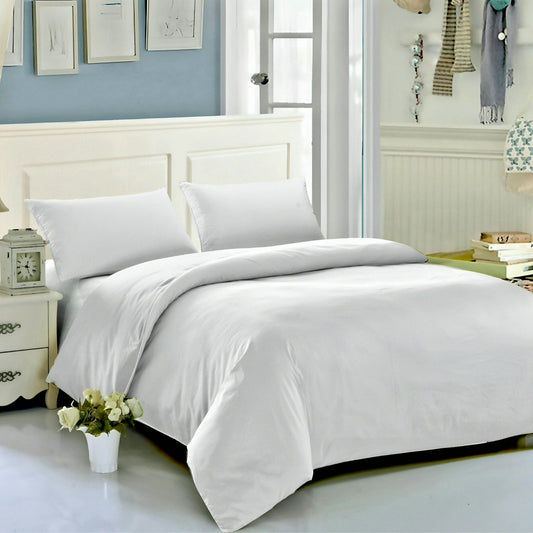Crisp luxury white duvet cover set on a modern bedroom bed, styled with pillowcovers