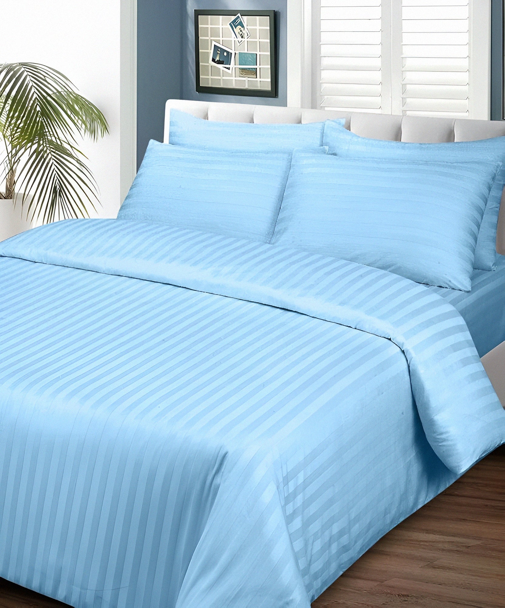 Plain Light Blue Luxury Bedsheet on Bed