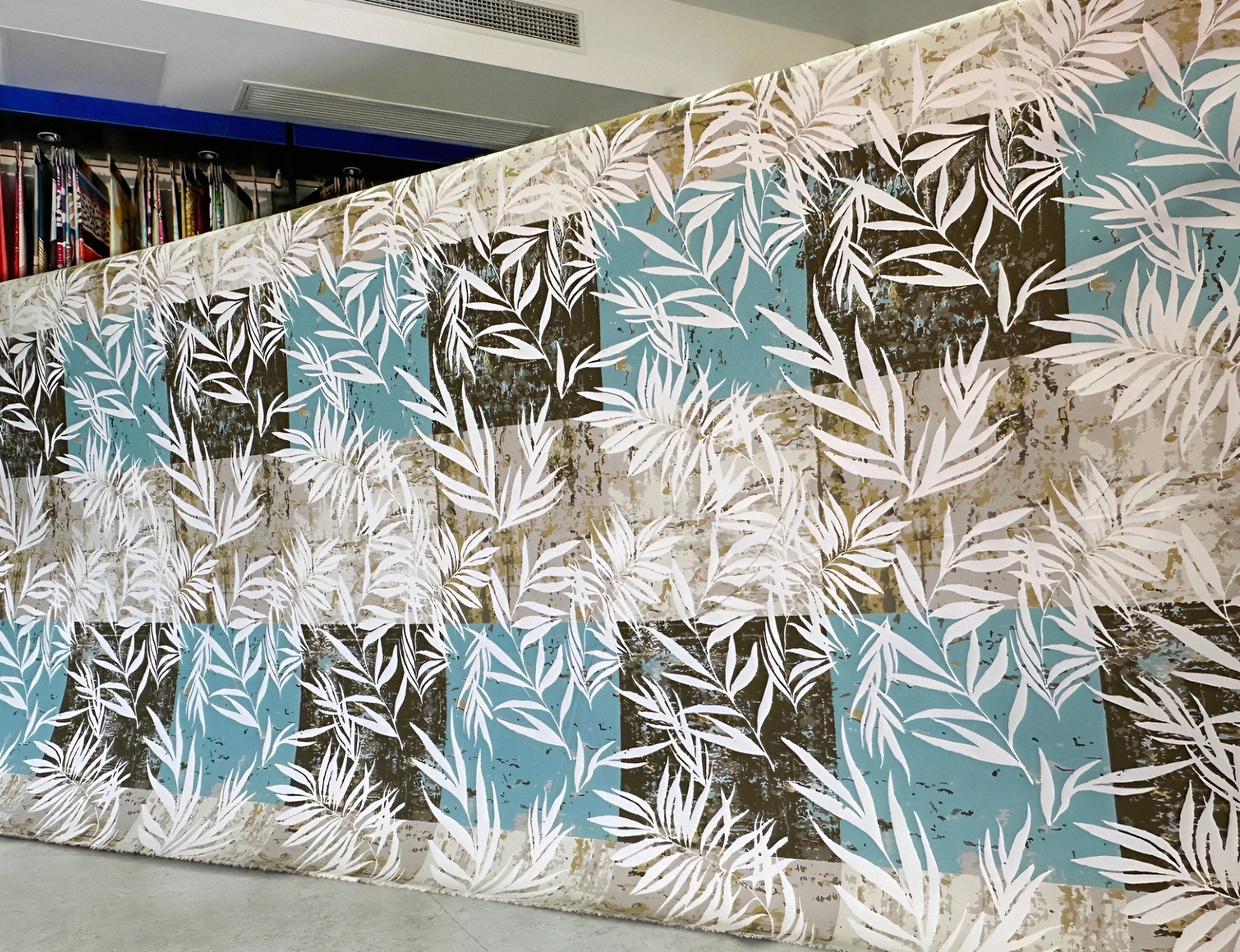 Close-up of cyan bedsheet roll fabric and gray accents, highlighting weave and finish.