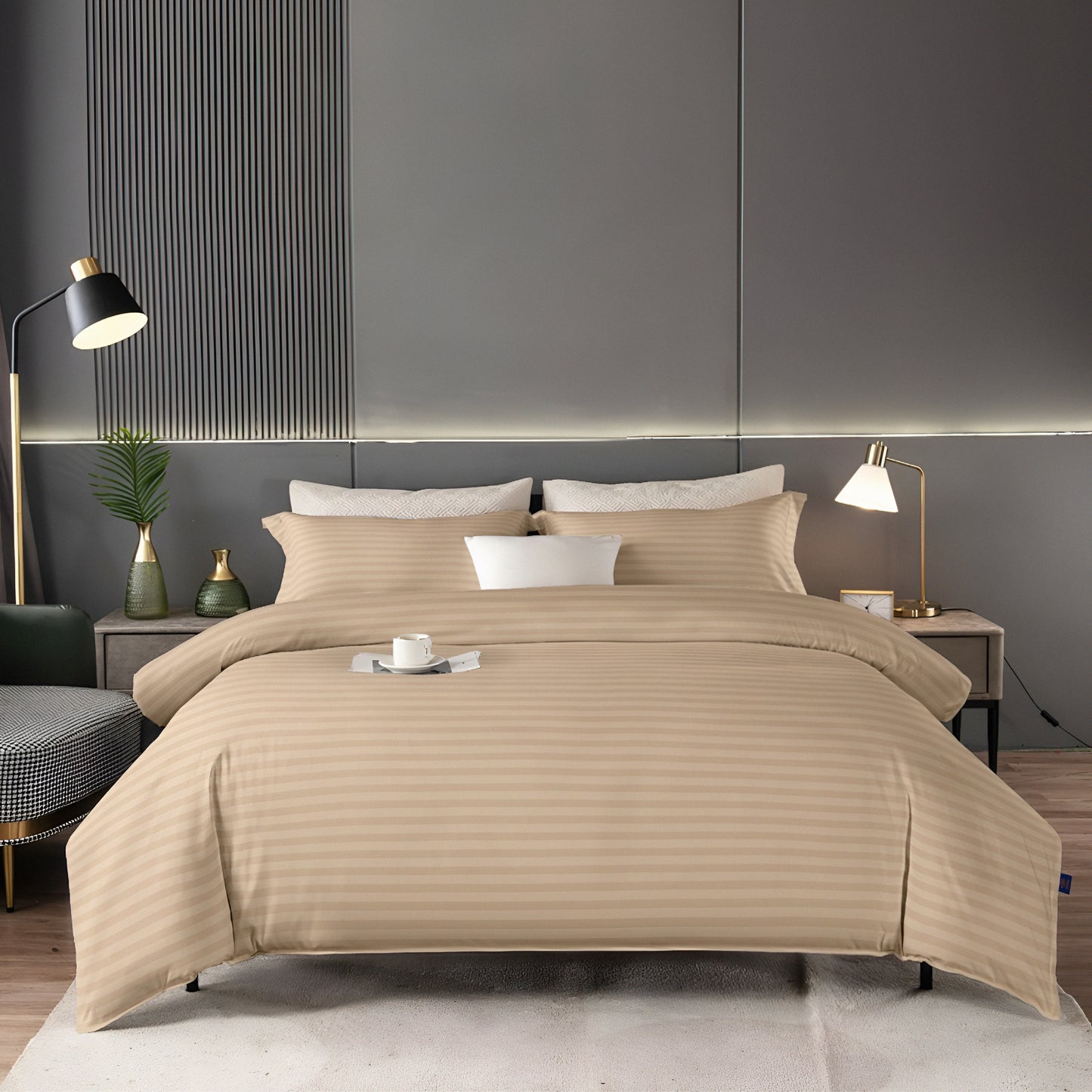 Beige bedding set on a bed in a modern bedroom with gray walls and decor.