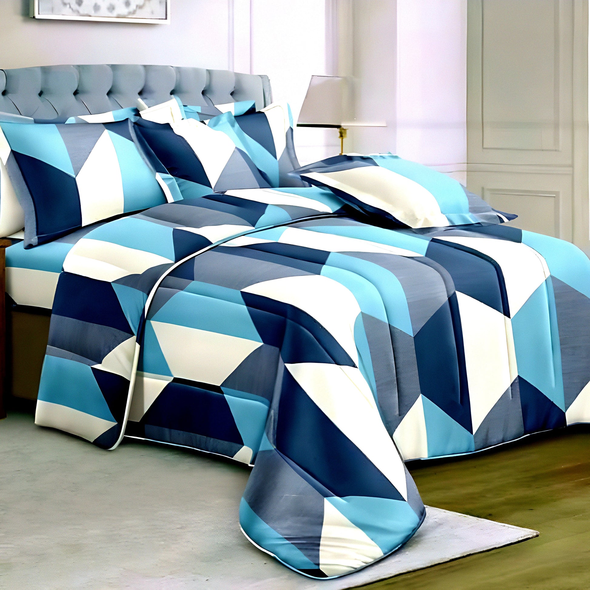 Blue geometric cotton bedsheet set on tufted grey headboard — Marjan3x UAE