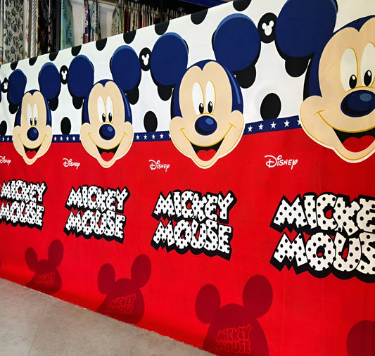 Mickey Mouse cartoon print cotton bedsheet with red base for kids.