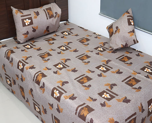 Bedspread with floral pattern on a bed in a room.