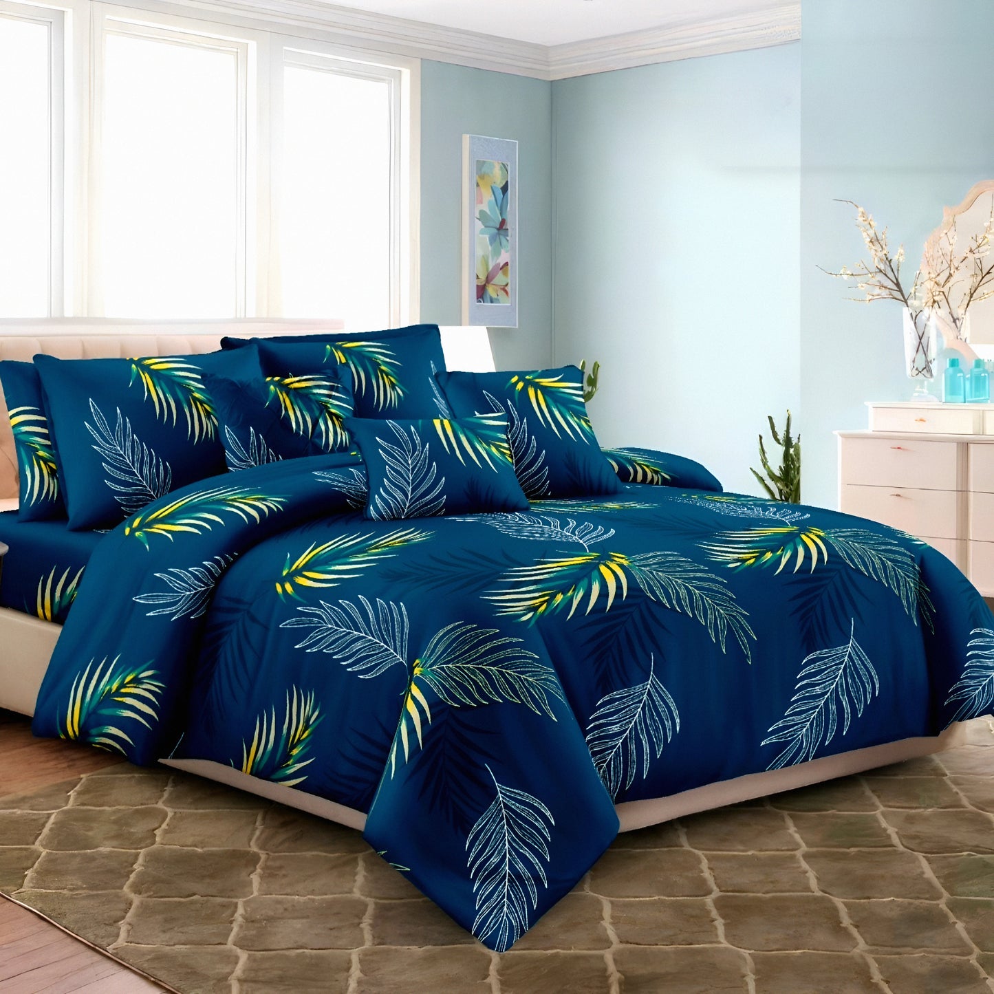 Navy bedsheet set with palm leaf print on a styled modern bedroom bed